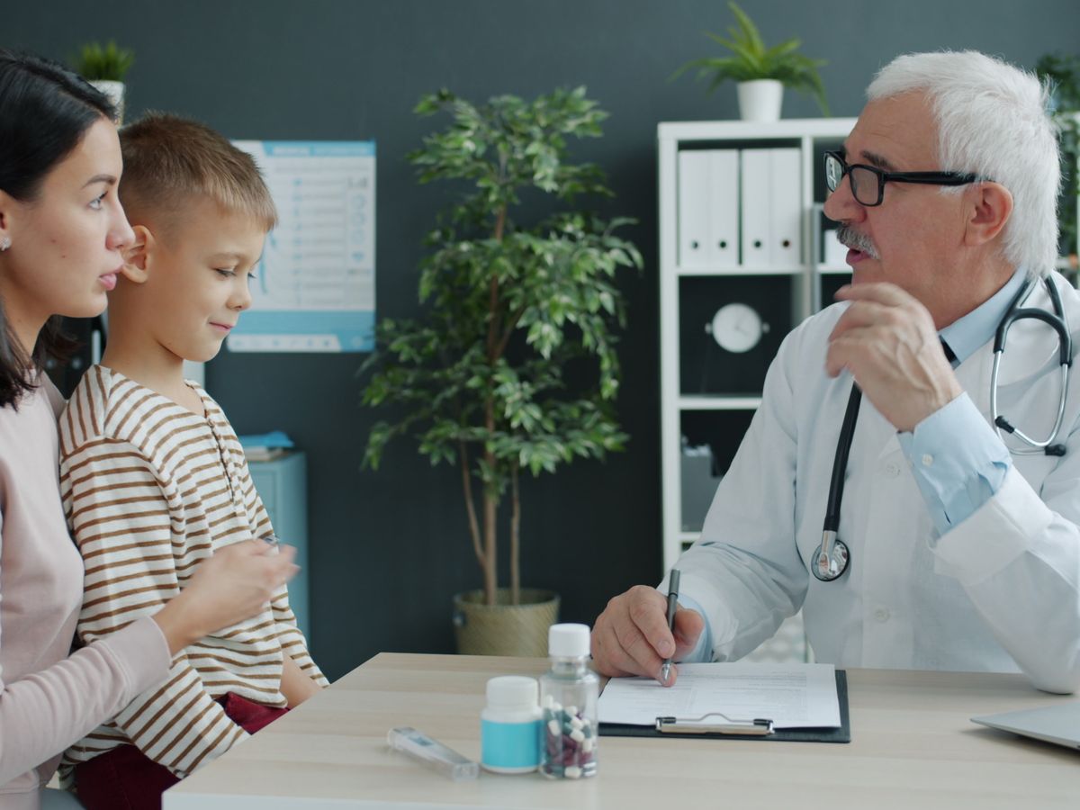 Doctor consulting with a mother and child