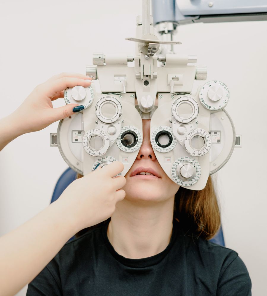 Optometrist examining a patient's eyes