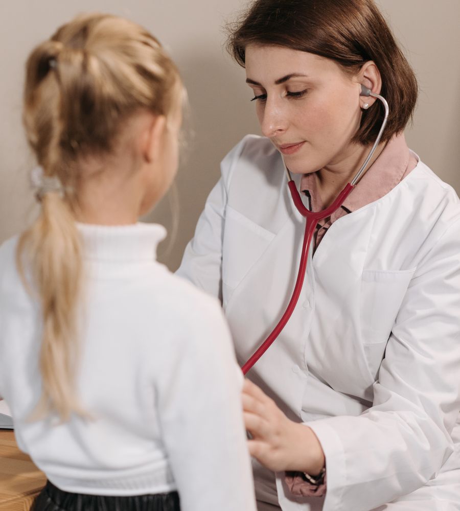 Pediatrician examining a child