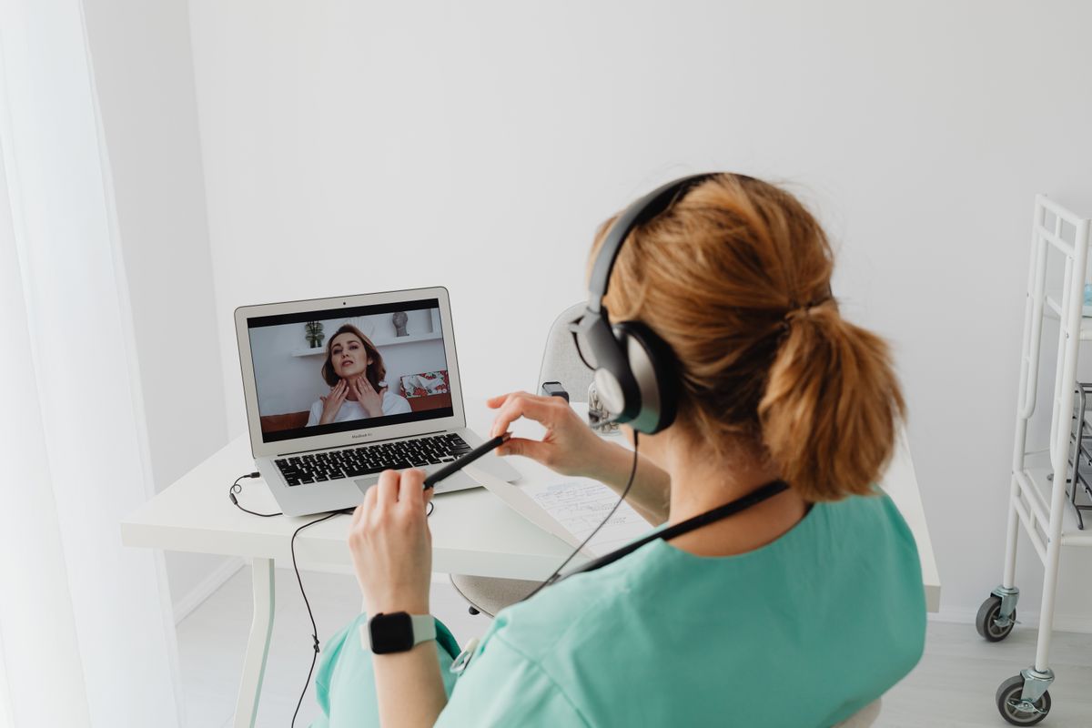 Clinician on a video call with a patient