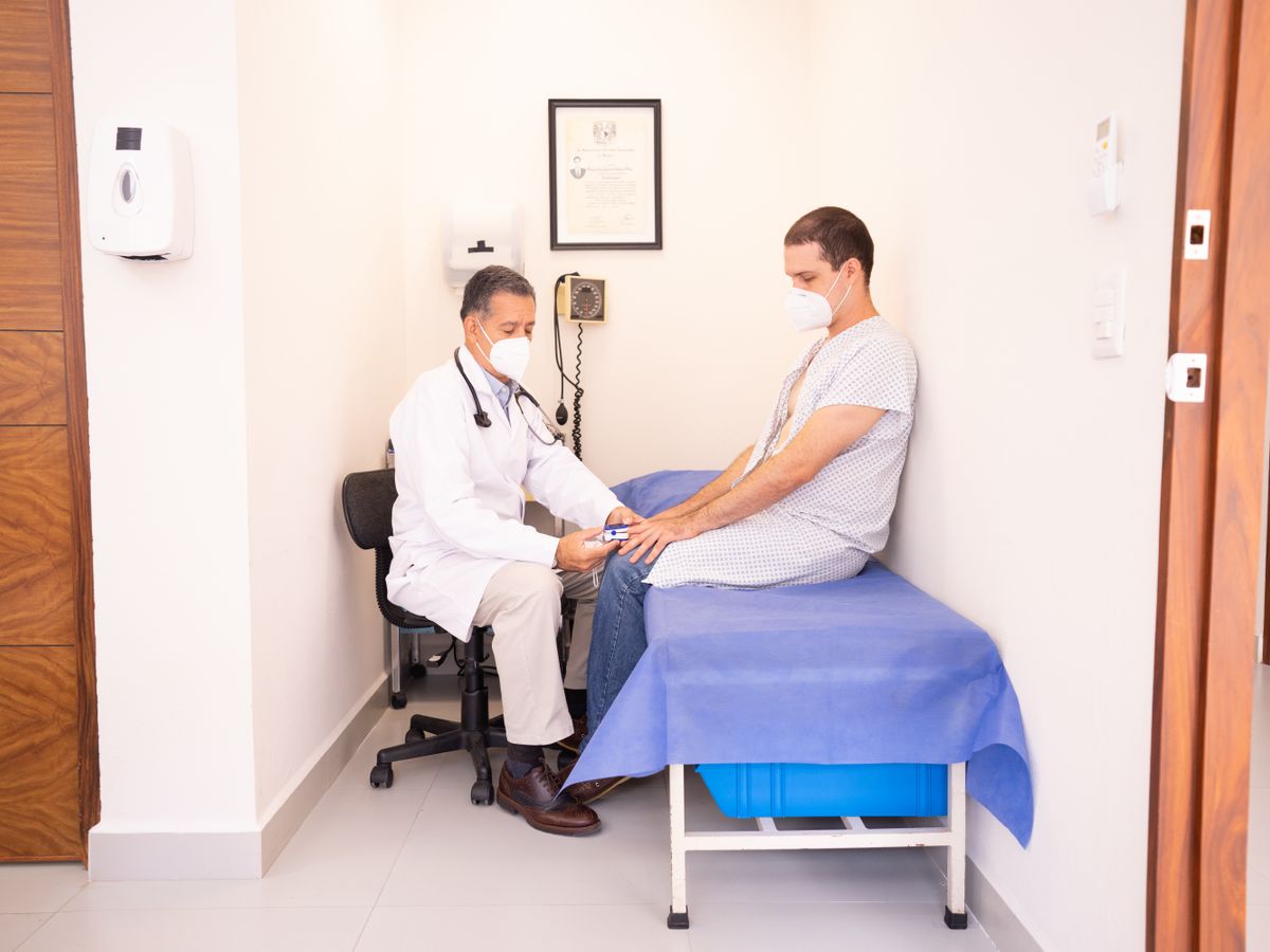 Doctor checking a patient's vitals