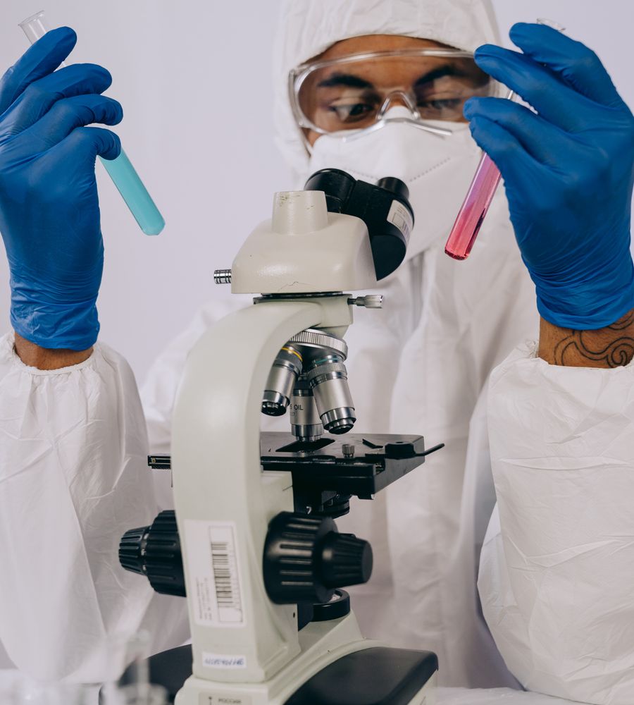 Laboratory scientist examining test tubes